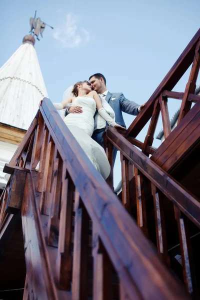 Newlyweds on the stairs — Stock Photo, Image