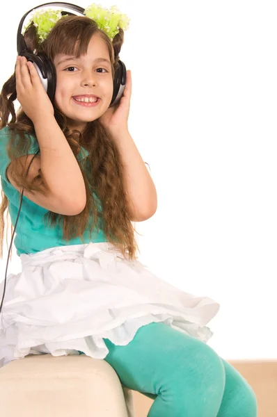 Mała dziewczynka i słuchawki — Zdjęcie stockowe