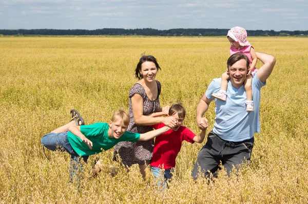 Cute family at field — Stock Photo, Image