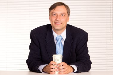 Smart businessman with money clipart