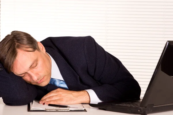 Businessman sleeping at office — Stock Photo, Image
