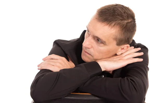 Man in a black sits — Stock Photo, Image