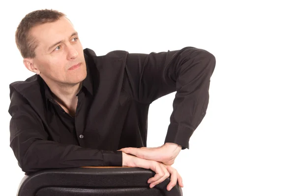Man in black sits — Stock Photo, Image