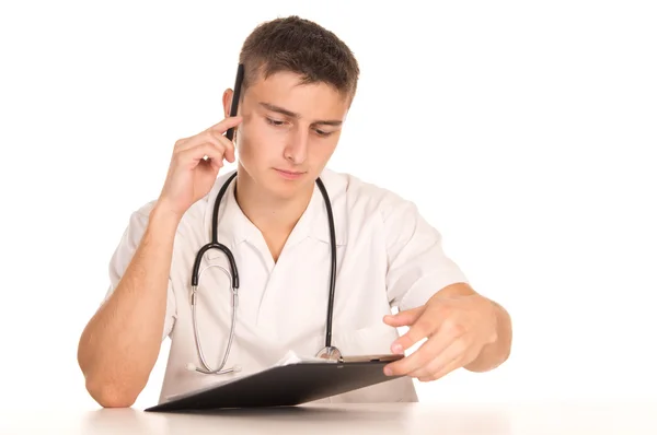 Young doctor at table — Stock Photo, Image