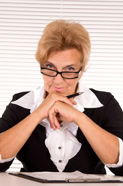 Aged woman at office — Stock Photo, Image
