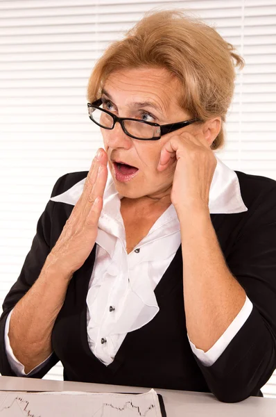Smart old woman at office — Stock Photo, Image