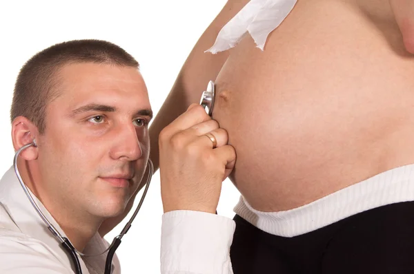 Беременная женщина и врач — стоковое фото