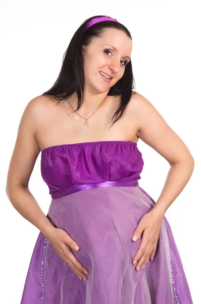 Беременная женщина в фиолетовом — стоковое фото