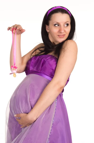 Беременная женщина в платье — стоковое фото