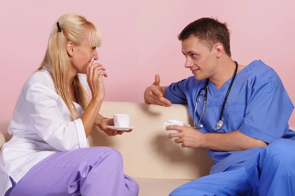 Doctors with cups — Stock Photo, Image