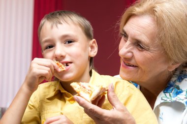 Granny and gramdson with pizza clipart