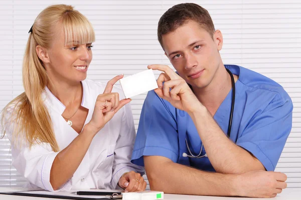 Doctors at table — Stock Photo, Image