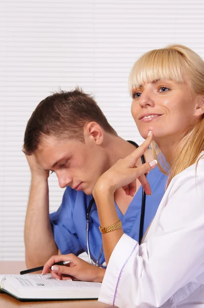 Doctors with book — Stock Photo, Image