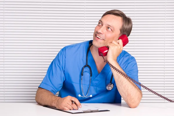 Doctor with telephone — Stok fotoğraf