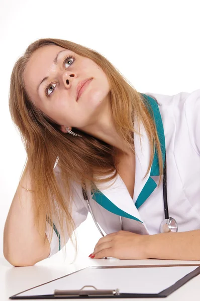 Sjuksköterska vid bord — Stockfoto