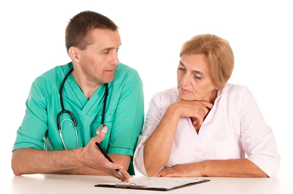 Doctors at table — Stock Photo, Image