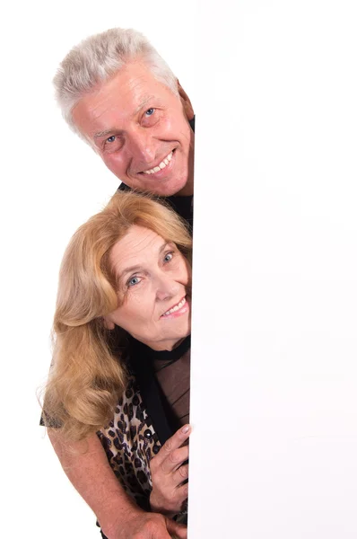 Oude paar met bord — Stockfoto