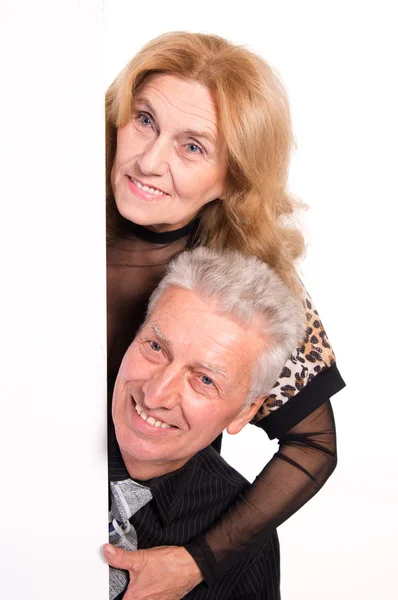 Oude paar met bord — Stockfoto