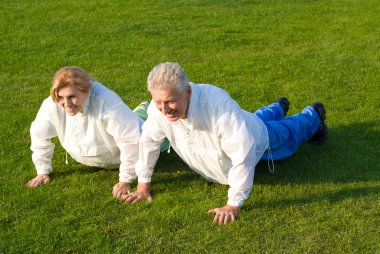 Old family pushing up on grass clipart