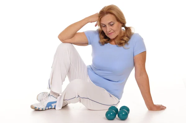 Aged woman with dumb bells — Stock Photo, Image