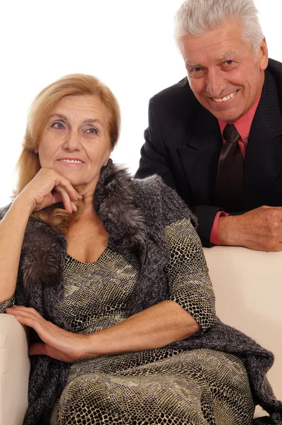 Old couple at sofa — Stock Photo, Image