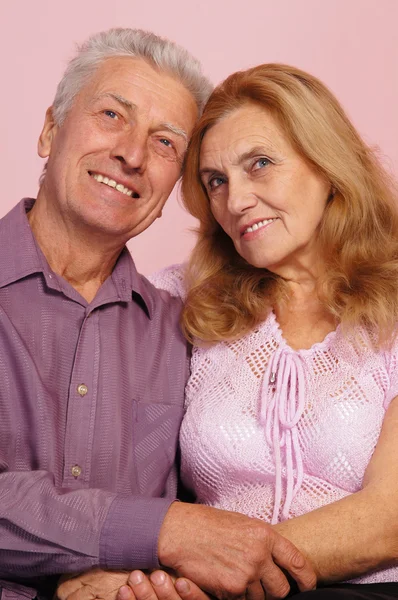 Old couple on pink — Stock Photo, Image