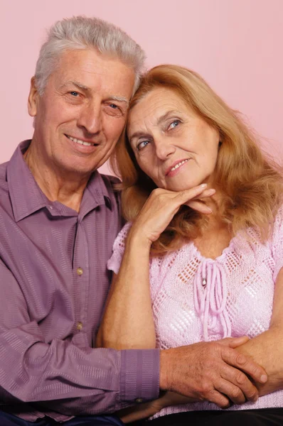 Old couple on pink — Stock Photo, Image