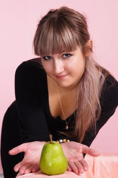 Girl and pear — Stock Photo, Image