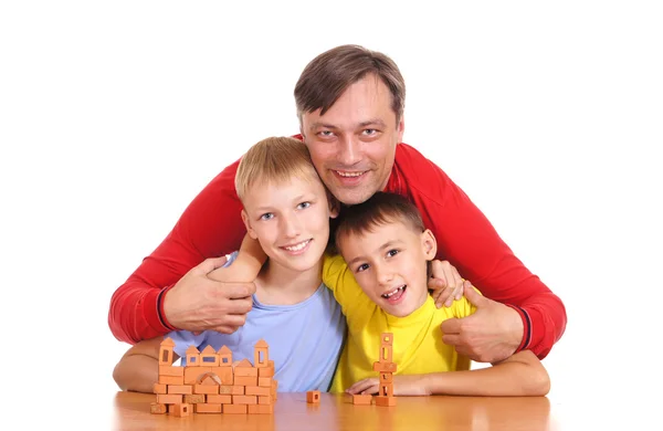 Papá con hijos en la mesa —  Fotos de Stock