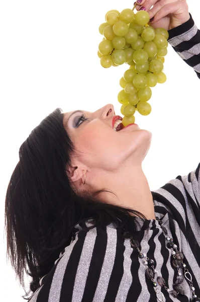 Flicka äter druvor — Stockfoto
