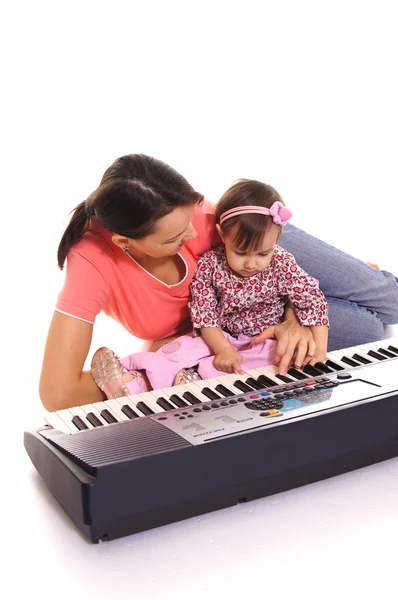 Mamma e bambino con pianoforte — Foto Stock