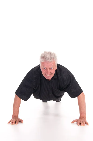 Starý muž dělá push up — Stock fotografie