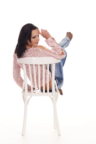 Brunetka i krzesło — Zdjęcie stockowe