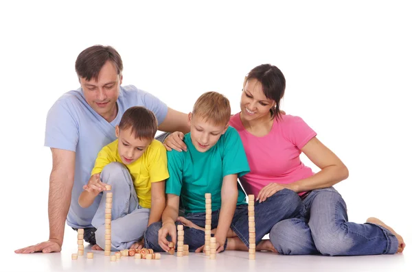 Семья играет на полу — стоковое фото