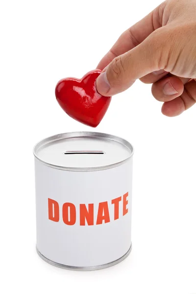 Donatie box en rood hart — Stockfoto