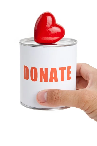 Donatie box en rood hart — Stockfoto