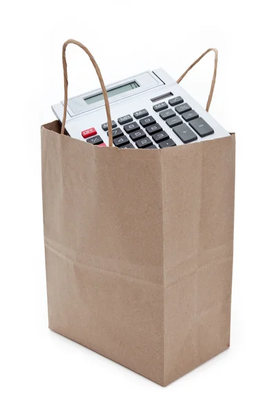 Bruine papieren boodschappentas en rekenmachine — Stockfoto