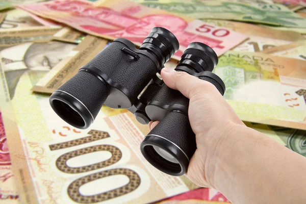 Binoculars and dollar — Stock Photo, Image