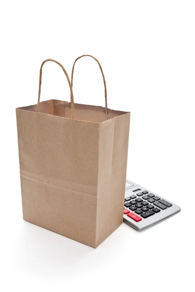 Brun papperspåse shopping och kalkylator — Stockfoto