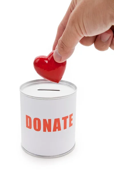Коробка для пожертвований и Красное сердце — стоковое фото