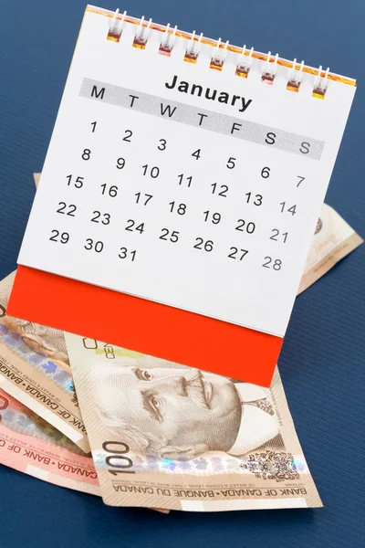 Calendario y dólar canadiense —  Fotos de Stock