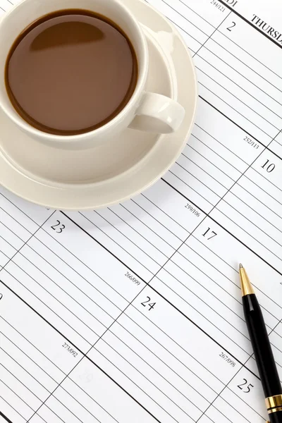 Tasse à café et calendrier — Photo