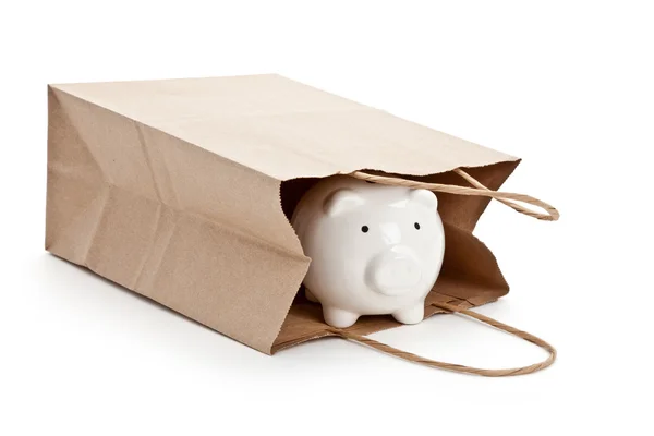 Brunt papir i handlepose og Piggy Bank – stockfoto