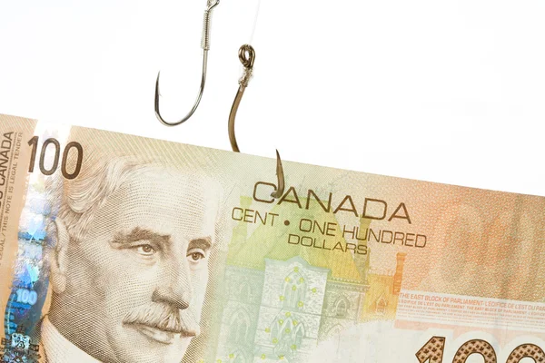 Visserij haak en Canadese dollar — Stockfoto