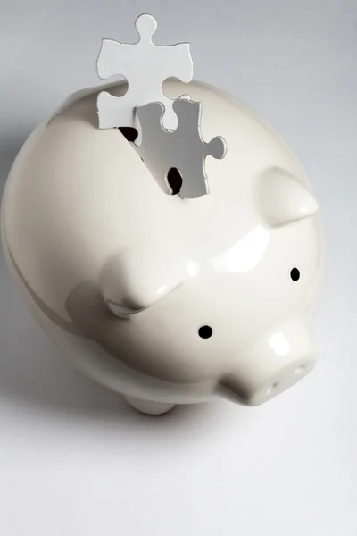 Piggy bank and Puzzle — Stock Photo, Image