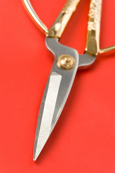 Złote nożyczki — Zdjęcie stockowe
