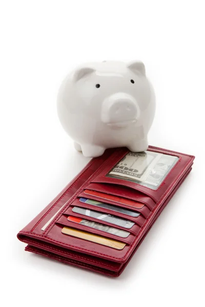 Röd plånbok och spargris — Stockfoto