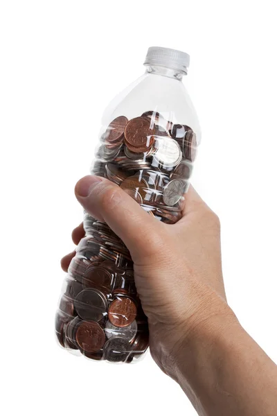 Bottiglia di plastica e monete — Foto Stock