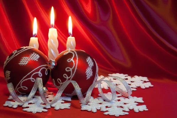 Christmas balls and candles. — Stock Photo, Image
