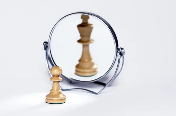 Chess pawn, chess king in mirror reflrction - Stock Image - Everypixel